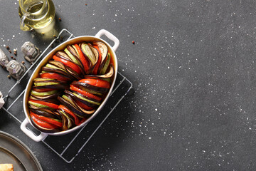 Baking dish of tasty Ratatouille on black background