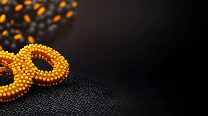 Fototapeta premium Close-up of vibrant orange and black abstract rings on a textured dark background