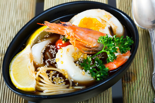 Spicy pan-Asian soup boiled with squid, shrimp, egg noodles and sesame