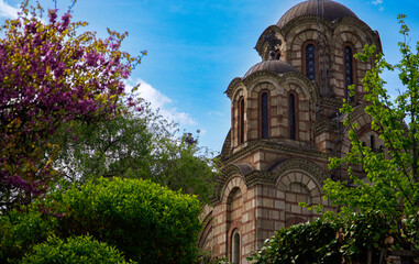 Fototapeta premium beautiful view of the old church nestled among the trees