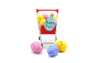 Shopping supermarket cart with colorful glitter easter eggs isolated on a white background. Happy...
