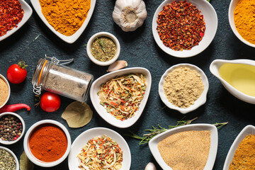 Composition with various aromatic spices on dark color background