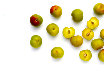 Fresh green plum fruit on white background.