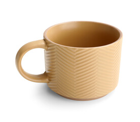Beige ceramic mug on white background