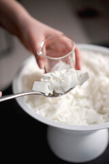 Spoon with Soy Wax Flakes for Candle Making