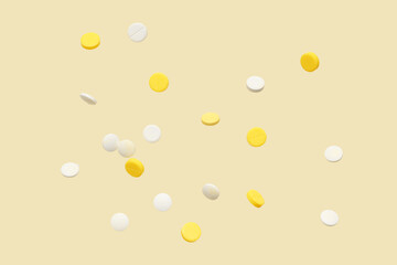 Flying different pills on yellow background