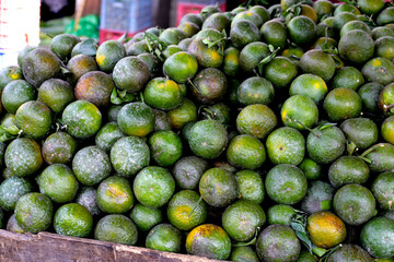 Fresh Vietnam green orange fruits on display at a local market in Vietnam