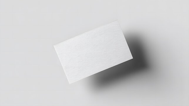 Blank white card on a flat surface, symbolizing simplicity and clarity in design