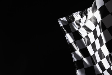 One racing checkered flag on black background, space for text