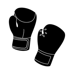 Boxing gloves ready for practice in a training gym environment during afternoon hours