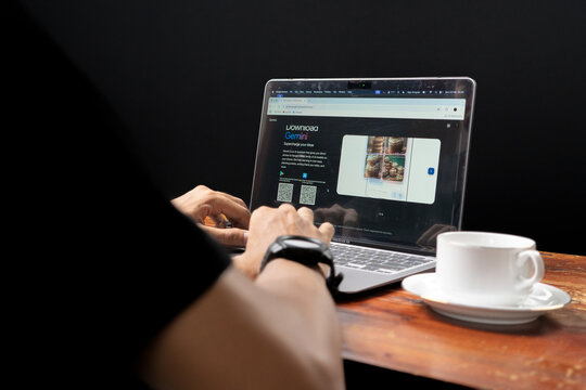 Close up view of the Gemini website on a laptop screen operated by an adult man
