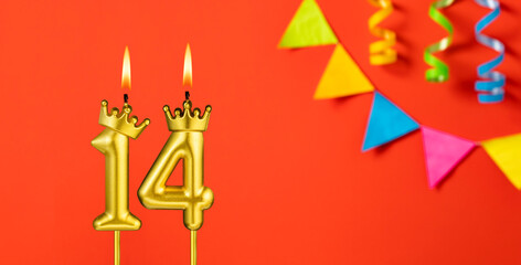 Number 14 birthday candle on an orange background with pennants