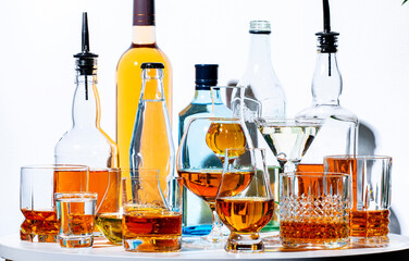 Strong hard alcoholic drinks, spirits, liqueurs, distillates, whiskey and others in glasses and...
