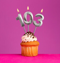 Birthday card on violet background - Candle number 103