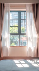 Window with curtains lets light into a room showing a blurred view.