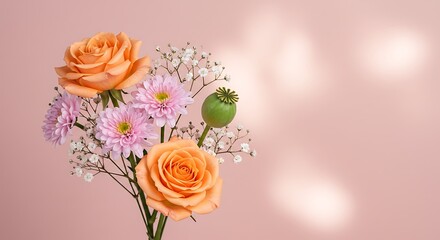 Elegant peach roses and pink chrysanthemums bouquet on light pink background