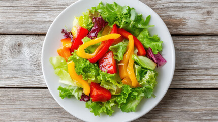 Fresh salad with vibrant bell peppers and mixed greens creates colorful and healthy dish, perfect for any meal