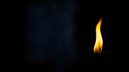 Eternal flame glowing in darkness  