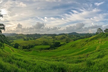 Naklejka premium Stunning Green Rice Terraces Landscape Scenic View Nature Hills sky lush rural image fields clouds 