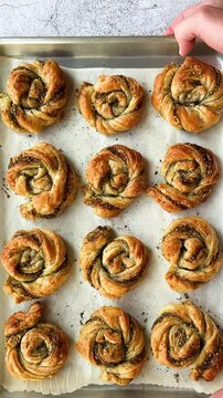 Za'atar Swirls with Hot Honey. Video of puff pastry pinwheels twists with Middle Eastern spice blend of zaatar and parmesan. It is drizzled with hot honey once baked  