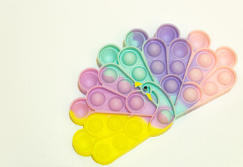 Colorful rainbow poppit relaxing game with white background