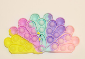 Colorful rainbow poppit relaxing game with white background