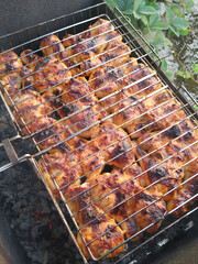 beef steak grilling on charcoal grill.