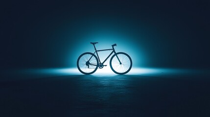 Bicycle illuminated by blue light in an empty industrial space at night