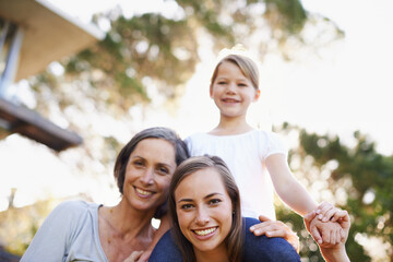 Mother, grandmother and girl in portrait with generations at family house by embrace, bonding and love in garden. Grandma, people and mom with kid on shoulders on vacation with nature for memory
