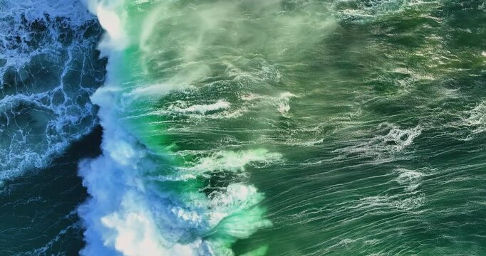 Stunning top-down aerial view of powerful deep blue ocean waves crashing with white foam during monsoon season tropical seascape perfect for travel, nature, and scenic summer backgrounds