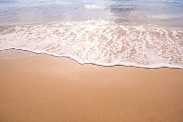 Nature of the beach and sea Summer with sunshine, sandy beaches, clear blue waters sparkling against the blue sky. On an island with good ecology and environment Background for summer vacation