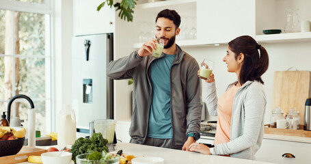 Drinking, health and couple with smoothie in kitchen at home for wellness, diet and nutrition...