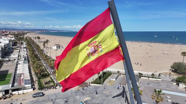 Spanish Flag At Valencia In Comunidad Valenciana Spain. Spain  Flag Scenery. Flag Wave Scene. Patriotic Spain Landscape. Spanish Flag At Valencia In Comunidad Valenciana Spain.