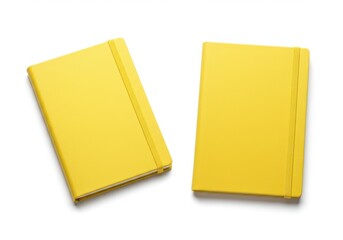 Two yellow notebooks lying on a white surface with an elastic band and clean minimalist look design