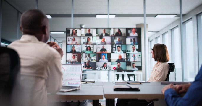 Business Professionals Collaborating During Online Video Conference - Powered by Adobe