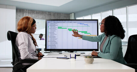 Skilled African American woman managing data