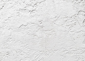 A white wall with a rough texture