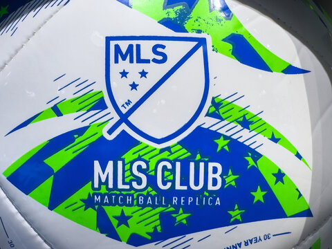 Calgary, Alberta, Canada. Apr 10, 2025. Close-up of the Adidas MLS Club match ball replica, showcasing the MLS logo and dynamic blue and green design on a white background
