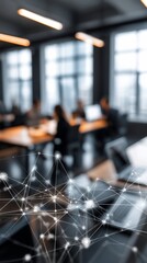 Abstract image of people meeting in a blurred office with network overlay