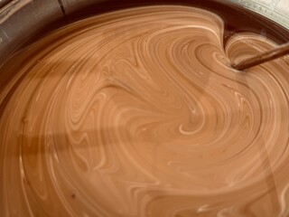 Abstract liquid mix in brown tones.