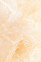 Fototapeta premium Elegant marble texture with soft orange and cream tones, perfect for backgrounds