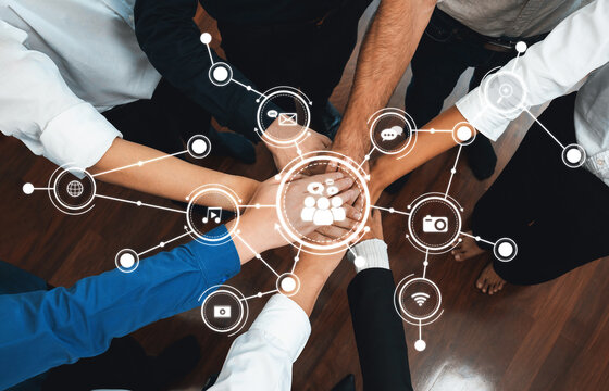 A dynamic composition of diverse hands coming together overlaid with digital communication icons, symbolizing collaboration and media interaction in a professional setting. Amity