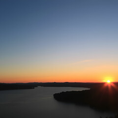 Scenic view of lake against sky during sunset
