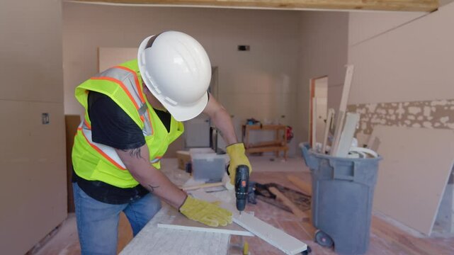 At a busy construction site, male builder using various tools, showcasing their skills and commitment to quality craftsmanship while planning a new house renovation