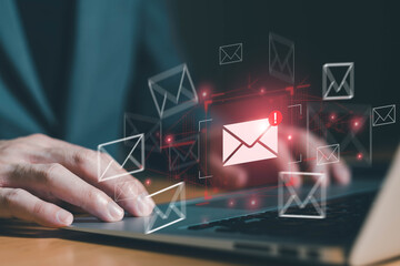 Business man using smartphone and computer that show warning sign after got attack phishing email...