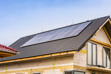 Photovoltaic panels on a roof of family house, solar panels.