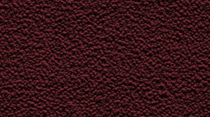 Fototapeta premium Top down view of seamless maroon felt texture, flat lighting.