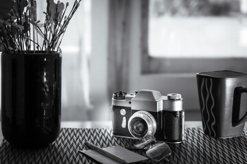 Black and White Still Life of Vintage Camera and Decor Items