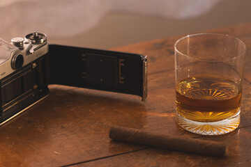 Open vintage Film Camera with Drink and Tobacco