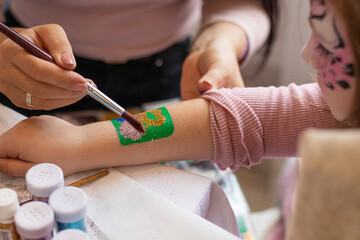 selective focus. decorative cosmetics for children and adults. holy Flash tattoo. Transfer tattoos...